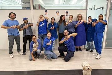 A group of people dressed in Dodger's blue.