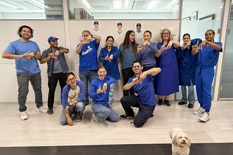 A group of people dressed in Dodger's blue.