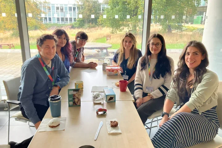 A group of scientists sitting around a table