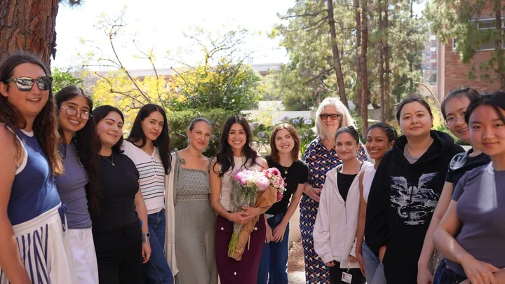A group of people posing for a picture at a party