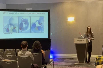 Woman giving a talk at a meeting