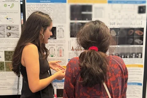 Two women at a scientific poster