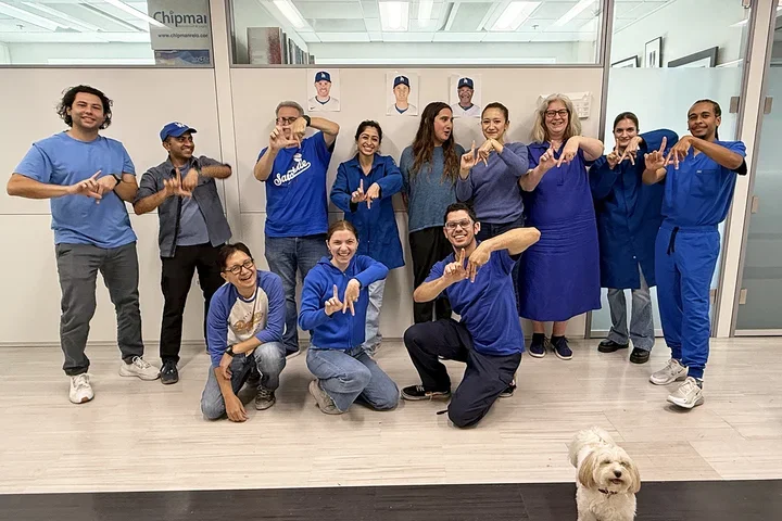 A group of people dressed in Dodger's blue.