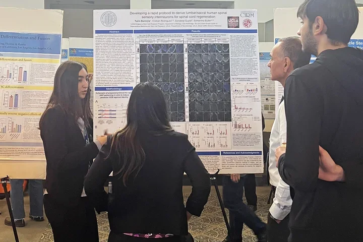 woman presenting a scientific poster