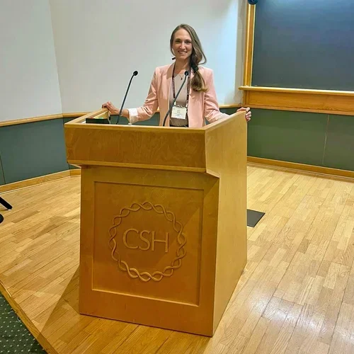 Woman at a podium about to give a talk