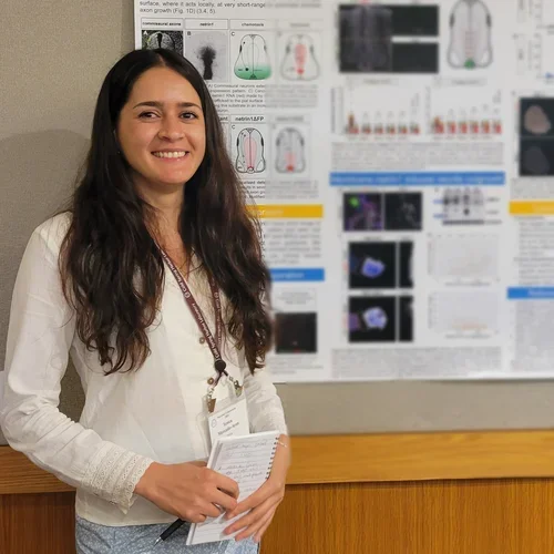 Woman standing in front of a poster