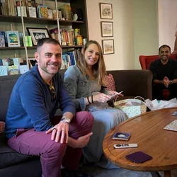 Two people opening presents