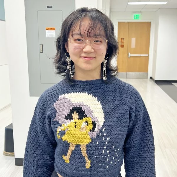 Charlene wearing hand-crocheted Morton salt sweater